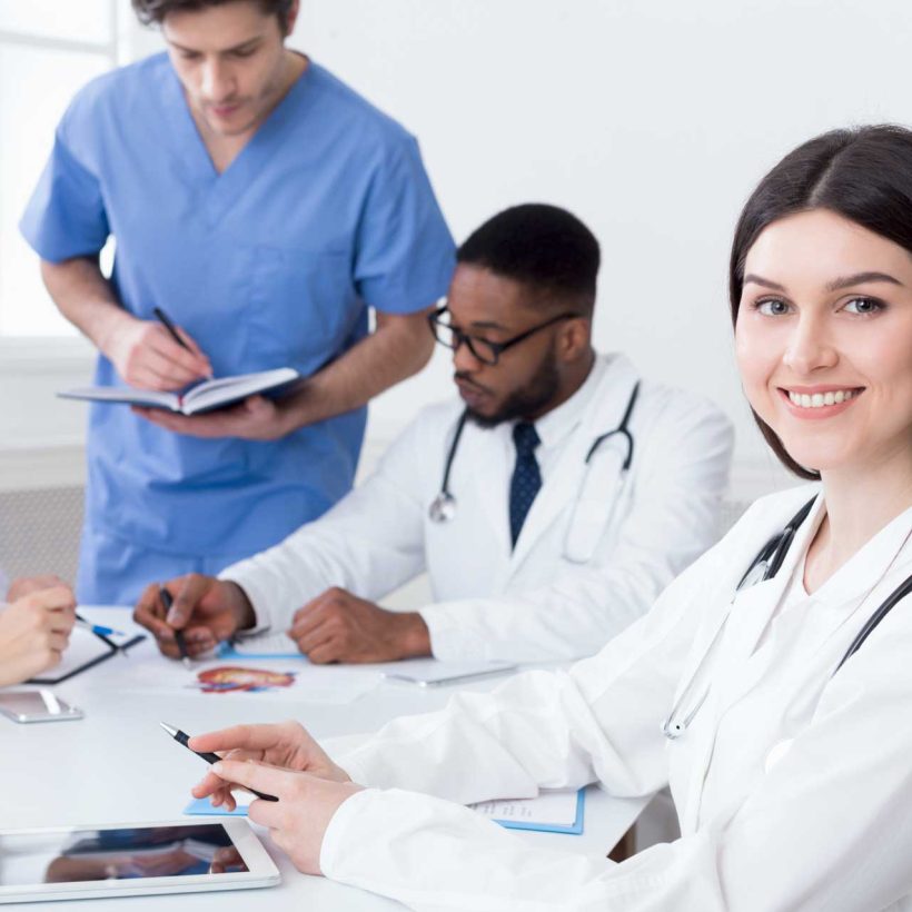 team-of-doctors-having-meeting-in-medical-office-24TWHC6